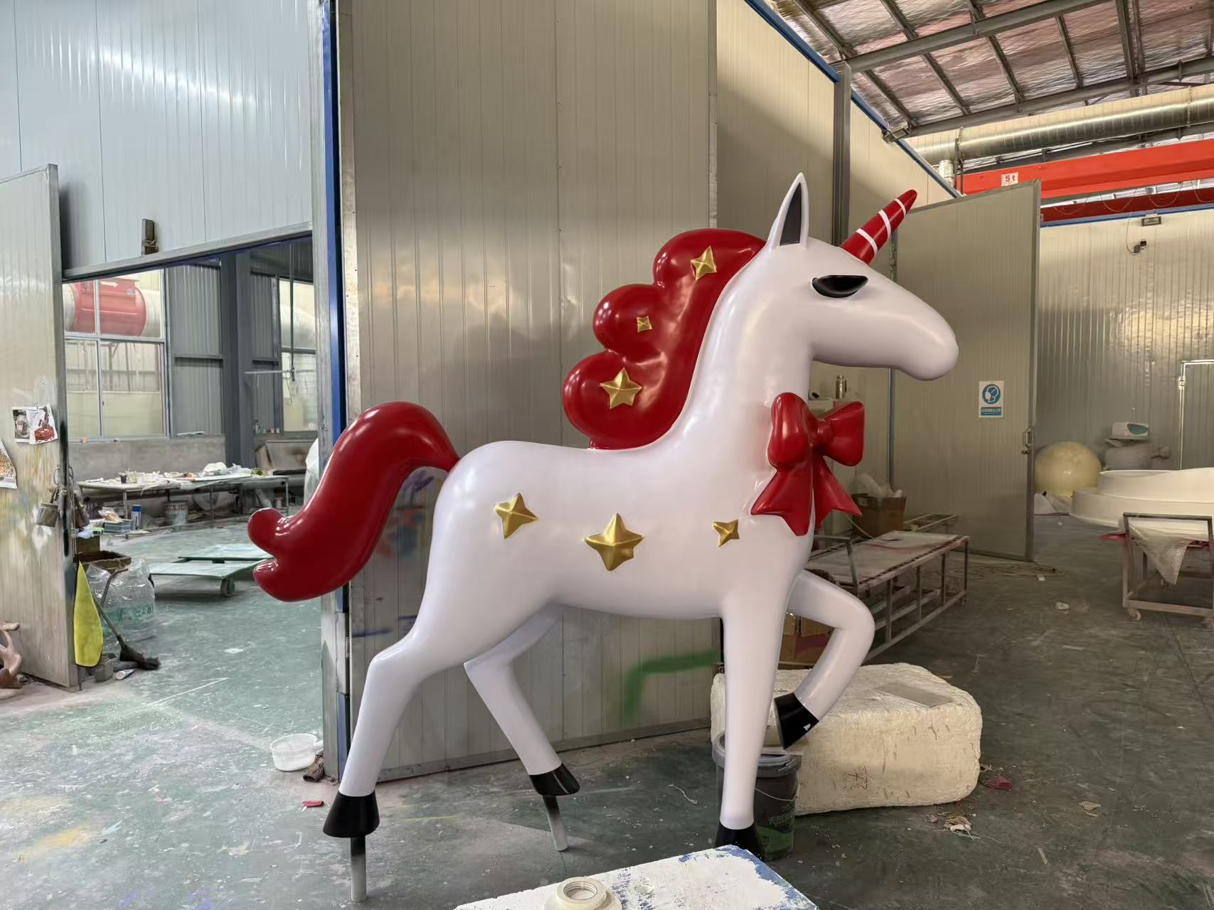 Character and IP sculpture in its original project or workshop setting